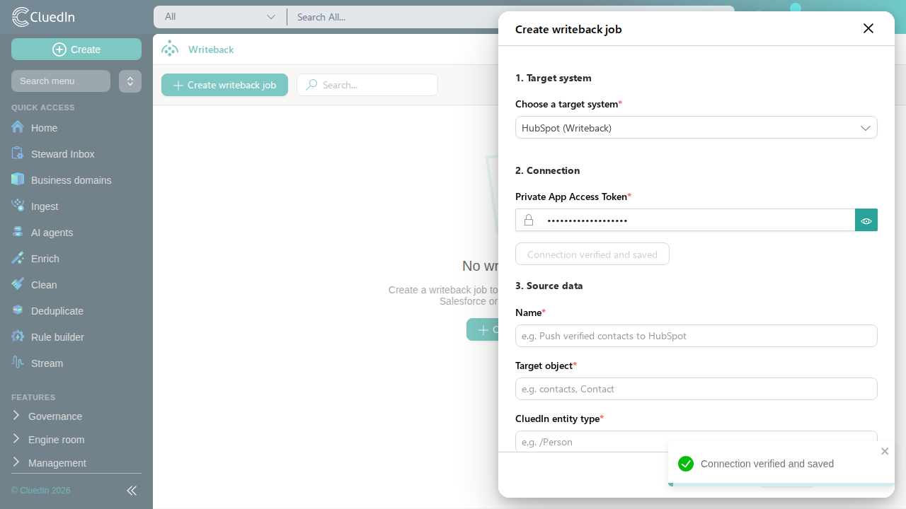 The writeback job creation panel, with HubSpot selected as the target system, a private app access token entered, and the connection verified and saved